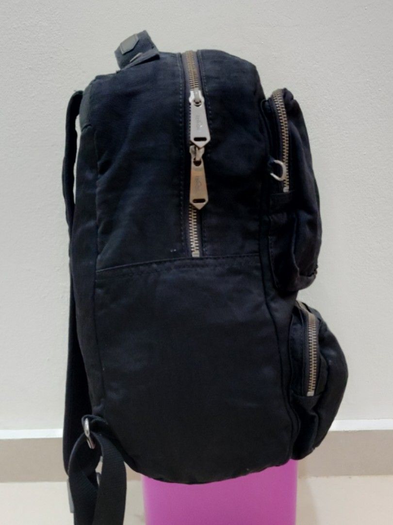 Kipling Backpack (Category: Backpacks) located in Sepang. Submitted by alee73 (Listing ID 1442072717, Image 3). Description: - Classic Kipling backpack - Multiple front zip pockets for easy access - Padded shoulder straps for comfortable carrying - Spacious interior, likely fits a laptop - Perfect for school, work, or everyday adventures - Zippers are in good working condition - Condition 9/10.