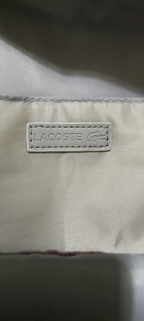Lacoste Grey Backpack (Category: Backpacks) located in Manila. Submitted by poshcara (Listing ID 1442129156, Image 2). Description: - Grey Lacoste backpack - Front zip pocket and main compartment - Padded straps and back for comfort - Lacoste logo prominently displayed on the front - Clean and simple design - Ideal for everyday use or travel.