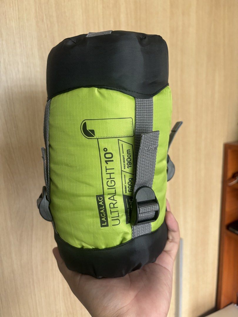 LAGALAG Ultralight 10° Sleeping Bag (Category: Hiking & Camping) located in Quezon City. Submitted by mcndrew (Listing ID 1441994675, Image 1). Description: - Brand: LAGALAG - Type: Ultralight Sleeping Bag - Weight: Only 600g! - Max User Height: Up to 190cm - Color: Bright Lime Green with Black Accents - Ideal for: Camping, hiking, and outdoor adventures - Features: Compact and lightweight for easy portability.