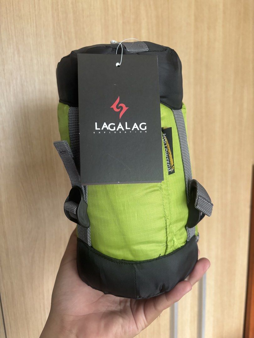 LAGALAG Ultralight 10° Sleeping Bag (Category: Hiking & Camping) located in Quezon City. Submitted by mcndrew (Listing ID 1441994675, Image 3). Description: - Brand: LAGALAG - Type: Ultralight Sleeping Bag - Weight: Only 600g! - Max User Height: Up to 190cm - Color: Bright Lime Green with Black Accents - Ideal for: Camping, hiking, and outdoor adventures - Features: Compact and lightweight for easy portability.