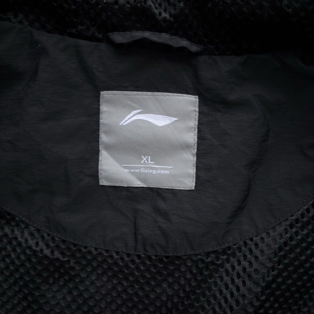 Li-Ning Black & Grey Windbreaker Jacket XL (Category: Coats, Jackets and Outerwear) located in Dasmarinas. Submitted by arthrthriftcop. (Listing ID 1442148066, Image 2). Description: - Brand: Li-Ning - Type: Windbreaker Jacket - Color: Black & Grey - Size: fit Large to XL - Features: Hood, Zip-up front, Reflective stripes on sleeves & shoulders - Condition: Some marks on the front (please check photos) - Ideal for: Outdoor activities issue check 