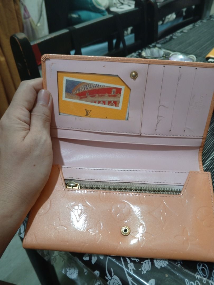 Louis Vuitton Vernis Long Wallet Peach (Category: Luxury Bags & Wallets) located in Manila. Submitted by wildflower67-88509 (Listing ID 1442010145, Image 2). Description: -Louis Vuitton Vernis long wallet - Color: Peach - Signature LV monogram pattern on exterior - Interior features a zip compartment and multiple card slots - Minor signs of wear on the interior card slots.