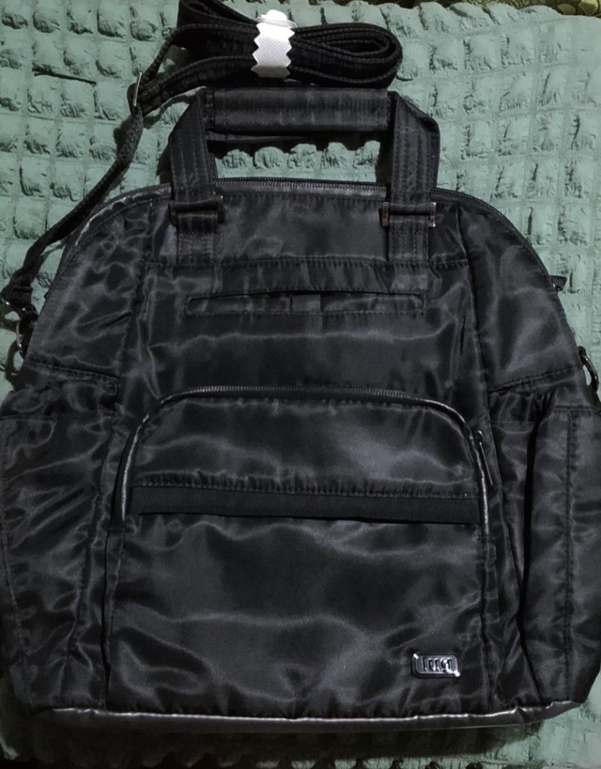 Lug Canter Convertible Shoulder/ Tote Bag (Category: Shoulder Bags) located in Manila. Submitted by rnursecoast08 (Listing ID 1440768989, Image 1). Description: Lug Canter Convertible Tote Bag Dimension: 10.5" W x 12.5"H x 5" D Weight: 1.44 lb Strap length: 29" to 56" Shoulder/ Strap Drop: 10" to 24" Handle Drop: 3" Backpack Strap: 19" to 32" Backpack Strap Drop: 10" to 16" Strap Width: 1.5" Exterior Features: One front soft lined slip pocket wit