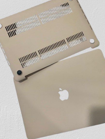MacBook Pro Hard Case - Beige (Category: Laptop Bags & Sleeves) located in Manila. Submitted by decluterthings888 (Listing ID 1442125594, Image 1). Description: - Protective hard case for your MacBook - Stylish beige color - Ventilation slots on bottom for cooling - Easy snap-on installation - Guards against scratches and minor bumps - Ideal for daily protection.