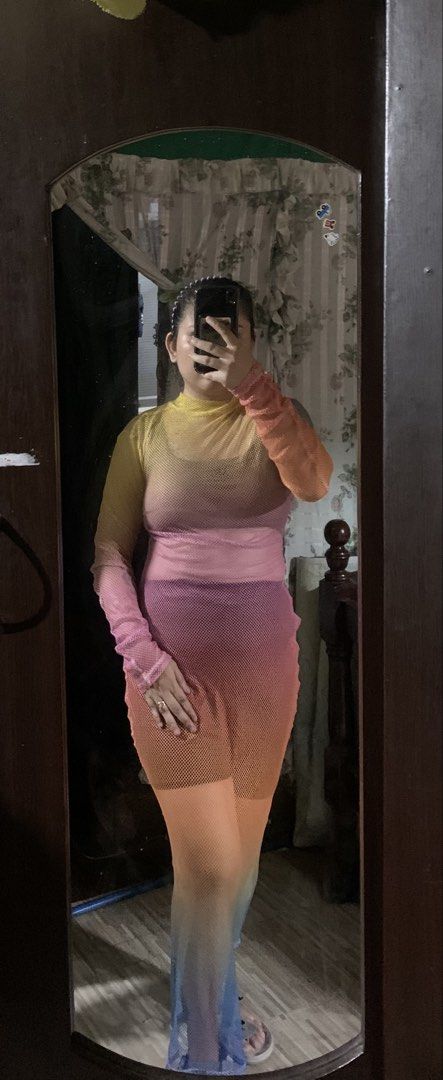 Mesh Ombre Long Sleeve Maxi Dress (Category: Dresses) located in Caloocan City. Submitted by kimpatchieee (Listing ID 1442014406, Image 1). Description: - Sheer mesh maxi dress - Stunning ombre color transition (yellow/orange to pink/blue) - Long sleeves - Fitted silhouette - Stretchy material for comfort - Versatile: great for layering or as a standalone statement piece.