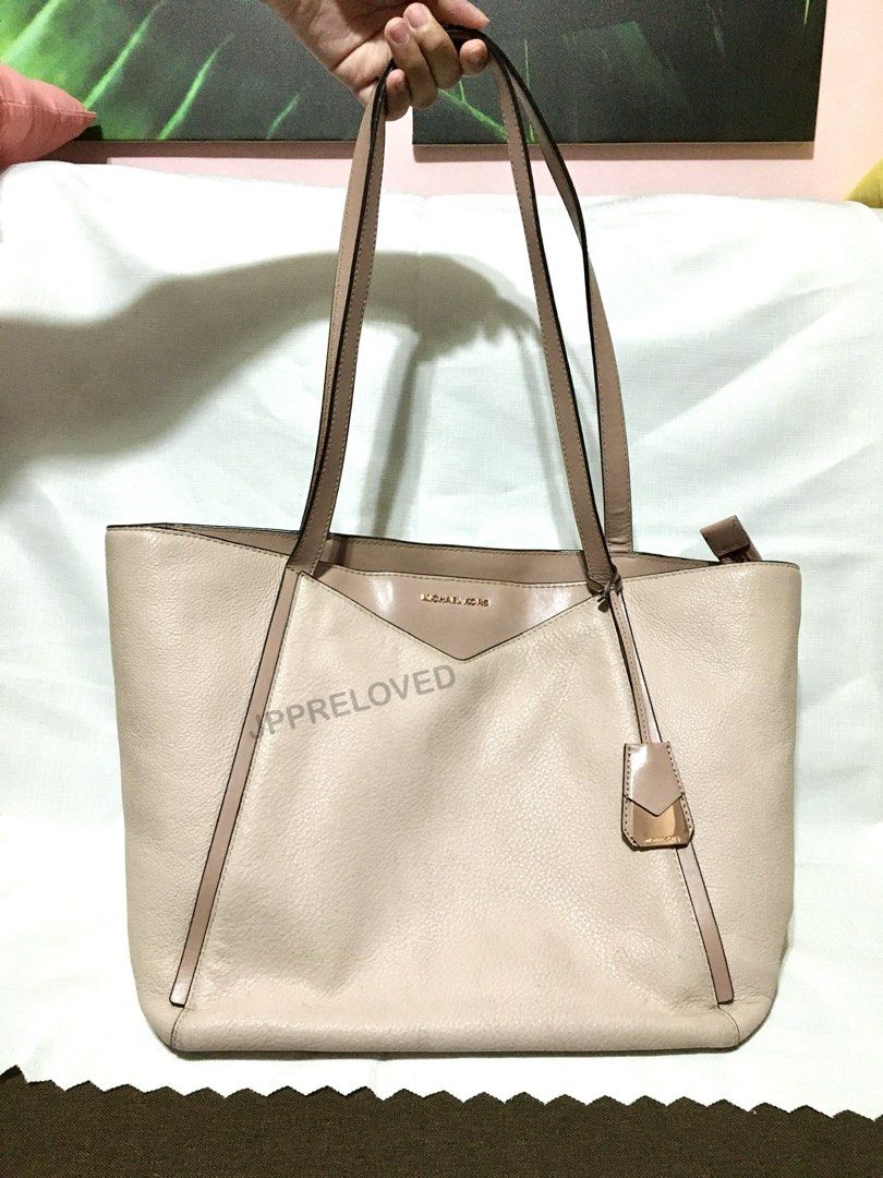 Michael Kors Whitney Pebbled Leather Tote Bag (Category: Luxury Bags & Wallets) located in Bacoor. Submitted by pbmypet (Listing ID 1441994808, Image 1). Description: FIXED PRICE/LAST PRICE - Authentic Michael Kors Whitney Tote Bag Elegant Rose-gold color - 100% Leather - Rose Gold-Tone Hardware (metal) - 17.5”W X 11”H X 7”D - Handle Drop: 11.5” - Exterior Details: Front Slip Pocket - Interior Details: Back Zip Pocket, 2 Back Slip Pockets, 6 Fron