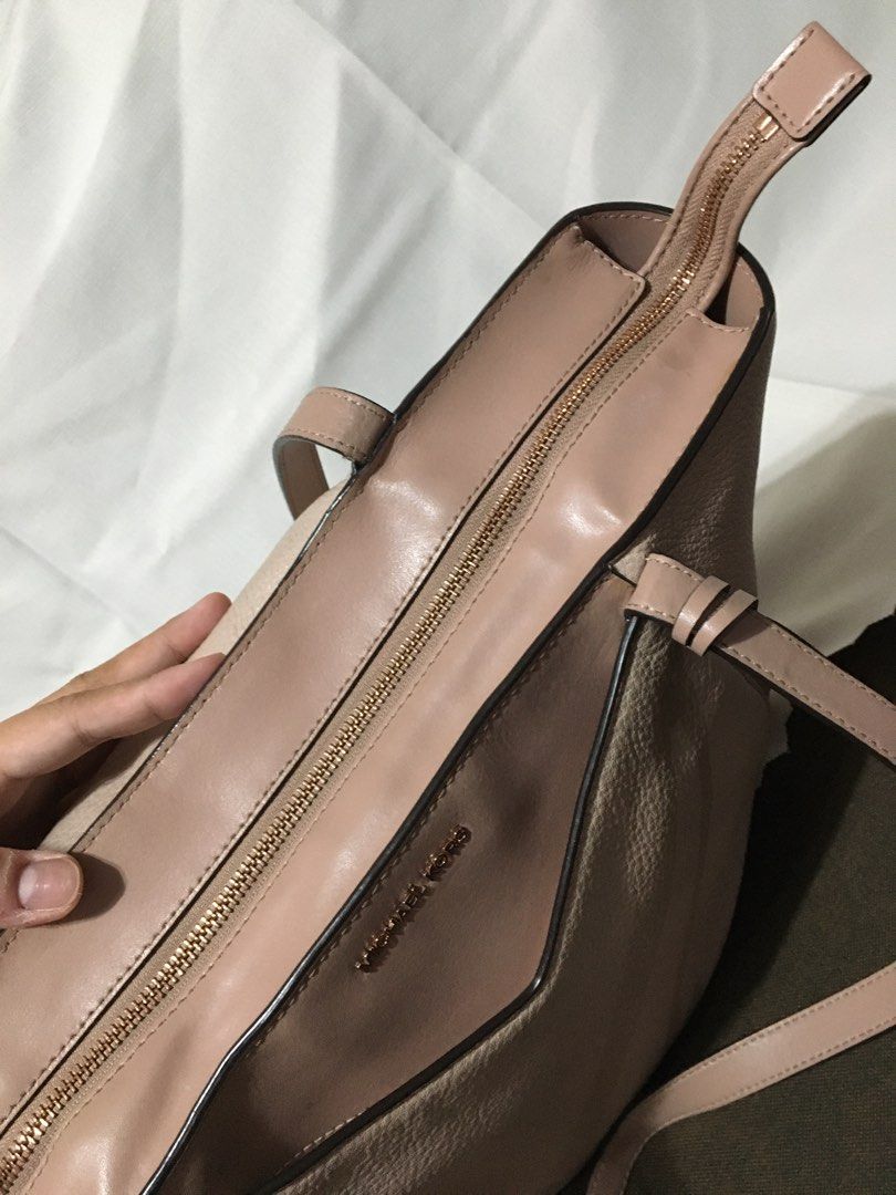 Michael Kors Whitney Pebbled Leather Tote Bag (Category: Luxury Bags & Wallets) located in Bacoor. Submitted by pbmypet (Listing ID 1441994808, Image 3). Description: FIXED PRICE/LAST PRICE - Authentic Michael Kors Whitney Tote Bag Elegant Rose-gold color - 100% Leather - Rose Gold-Tone Hardware (metal) - 17.5”W X 11”H X 7”D - Handle Drop: 11.5” - Exterior Details: Front Slip Pocket - Interior Details: Back Zip Pocket, 2 Back Slip Pockets, 6 Fron