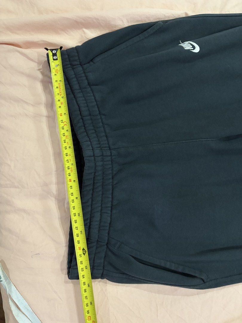 Nike Black Jogger Sweatpants (Category: Joggers) located in Mandaluyong City. Submitted by getbounced (Listing ID 1442084382, Image 2). Description: - Black Nike joggers - Elastic waistband with drawstring - Ribbed cuffs - Two side pockets - Small Nike logo on left leg - Ideal for lounging and workouts.