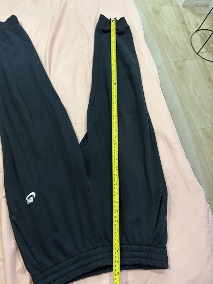 Nike Black Jogger Sweatpants (Category: Joggers) located in Mandaluyong City. Submitted by getbounced (Listing ID 1442084382, Image 3). Description: - Black Nike joggers - Elastic waistband with drawstring - Ribbed cuffs - Two side pockets - Small Nike logo on left leg - Ideal for lounging and workouts.