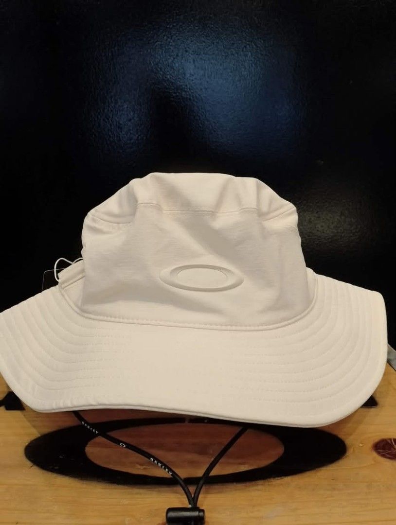 Oakley Bucket Hat - White and Aviator Green (Category: Caps & Hats) located in Quezon City. Submitted by sirc_26 (Listing ID 1441993869, Image 1). Description: - Two Oakley bucket hats available: White and Aviator Green. - Features the iconic Oakley logo. - Ideal for sunny weather protection. - Adjustable strap for a comfortable, secure fit. - S/M & L/XL.
