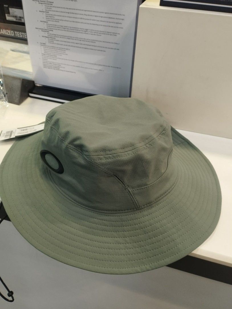 Oakley Bucket Hat - White and Aviator Green (Category: Caps & Hats) located in Quezon City. Submitted by sirc_26 (Listing ID 1441993869, Image 2). Description: - Two Oakley bucket hats available: White and Aviator Green. - Features the iconic Oakley logo. - Ideal for sunny weather protection. - Adjustable strap for a comfortable, secure fit. - S/M & L/XL.