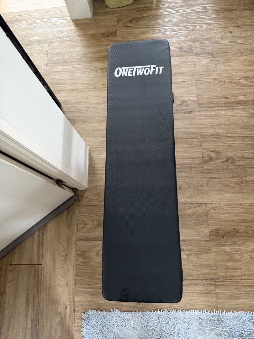ONE TWO FIT Flat Weight Bench for Home Gym (Category: Weights & Dumbbells) located in Pasig City. Submitted by lortega (Listing ID 1441997600, Image 2). Description: - ONE TWO FIT Flat Bench - Ideal for home workouts - Sturdy and reliable construction - Easy to store - Perfect for lifting and bodyweight exercises RFS: Decluttering. .