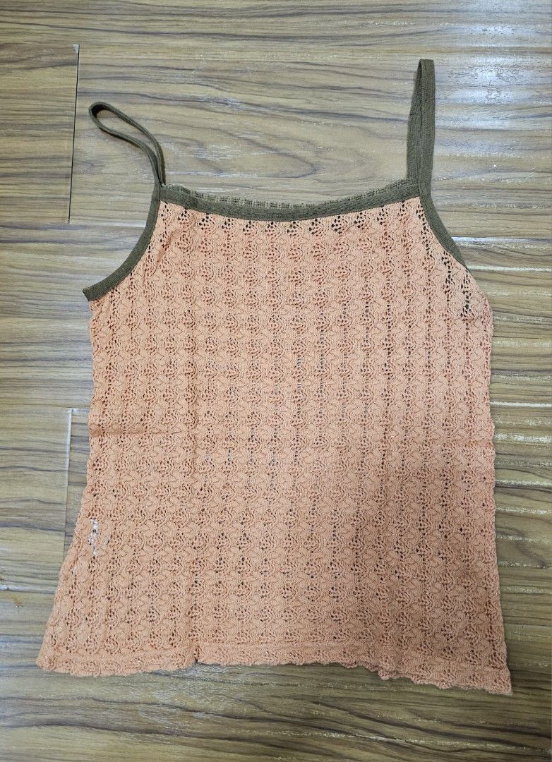 Orange Crochet Knit Spaghetti Strap Tank Top (Category: Sleeveless) located in Caloocan City. Submitted by jadorearchive (Listing ID 1442092179, Image 2). Description: - Orange crochet knit tank top - Features delicate spaghetti straps - Slightly sheer knit pattern - Perfect for beach trips or casual outings.