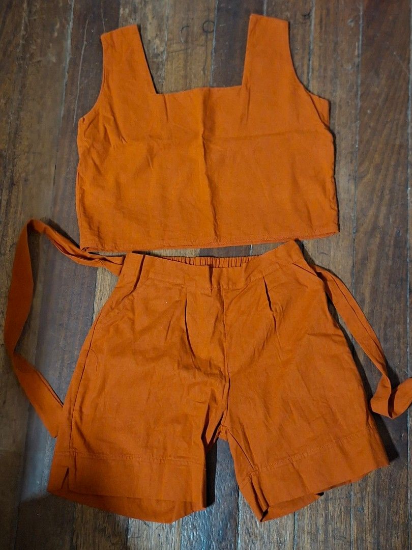 Orange Top and Skirt Set (Category: Sets or Coordinates) located in Manila. Submitted by aycgera (Listing ID 1442078955, Image 1). Description: - Orange top and skirt set - Top: Short sleeves, simple cut - Skirt: Adjustable side ties - Material: Soft fabric - Perfect for: Casual wear or lounging.