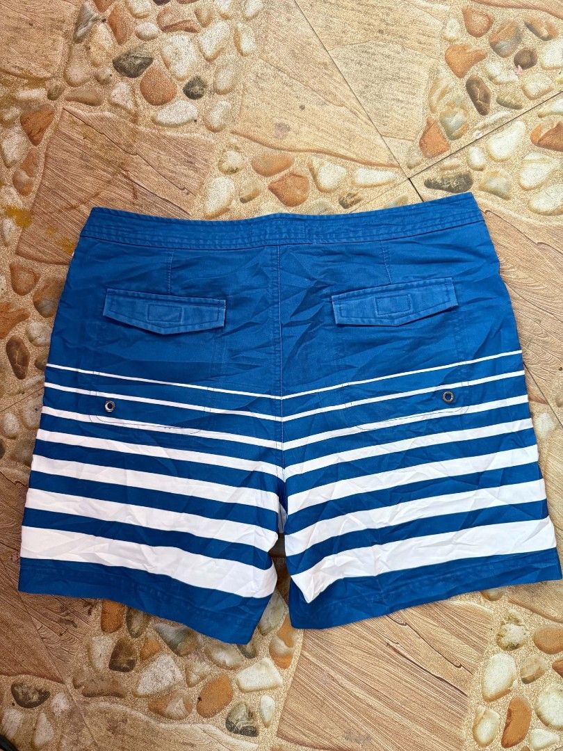 Original Penguin Striped Swim Trunks Blue White (Category: Swim Trunks & Board Shorts) located in Bayambang. Submitted by ace_found_it_06 (Listing ID 1442079463, Image 2). Description: - Original Penguin blue and white striped swim trunks - Features a drawstring waist - Includes back pockets - Iconic Penguin logo on the front - Ideal for beach days or pool lounging DM 📩📩 - Pangasinan Based.