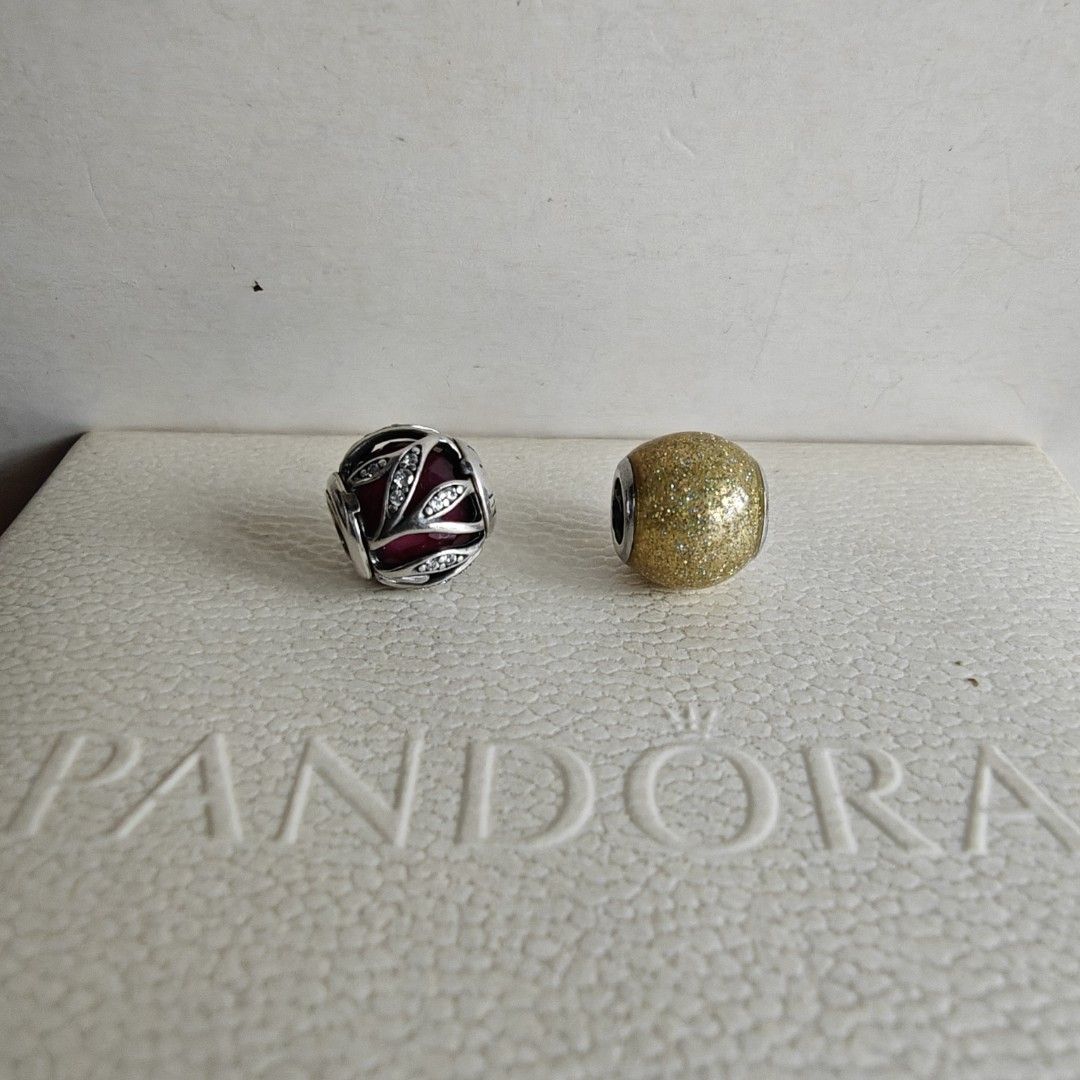 Pandora charms (Category: Charms) located in Makati City. Submitted by ly12eb (Listing ID 1442068211, Image 1). Description: Authentic Very good to excellent condition Nature's radiance euc 1.7k Gold glitter ball very good condition 1.1k -dark gold color, faded hallmarks.