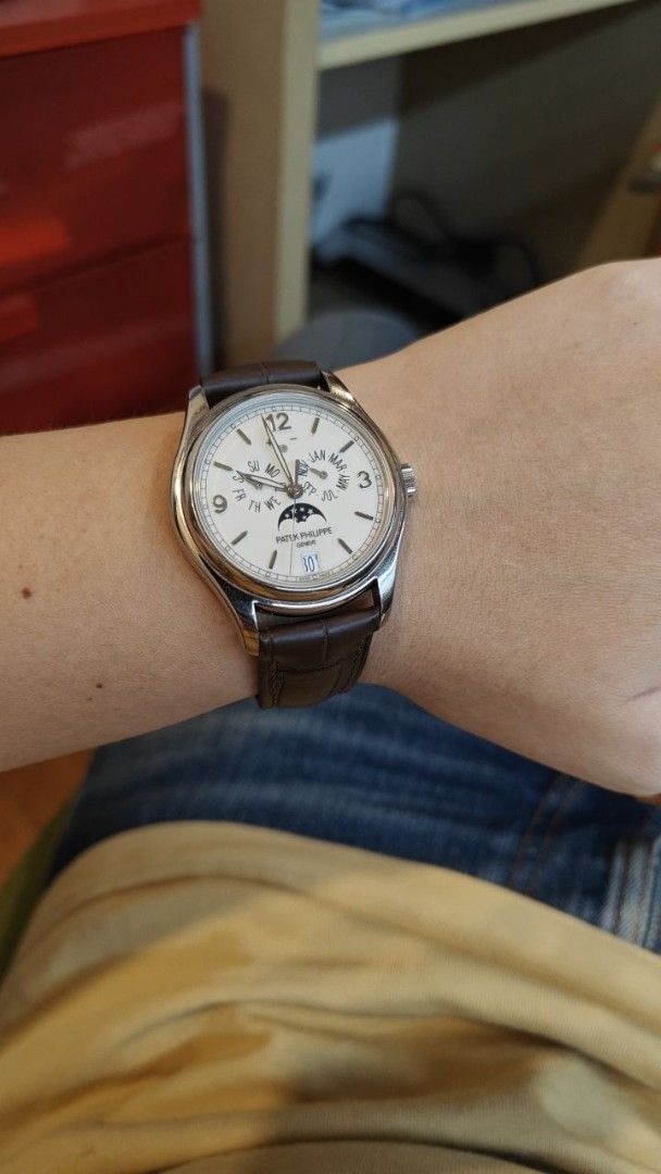 Patek Philippe Annual Calendar 5146G Ivory / Cream Dial 2016 Dated (Category: Watches) located in Singapore. Submitted by kylitos (Listing ID 1442111301, Image 3). Description: Watch only with close-up photos taken by PP Service Centre for application of archive extracts. Unpolished condition, 2016 Model with PP seal on movement. White gold case with white gold calatrava cross deployant on custom alligator strap. Last serviced at WatchLab in Mar 