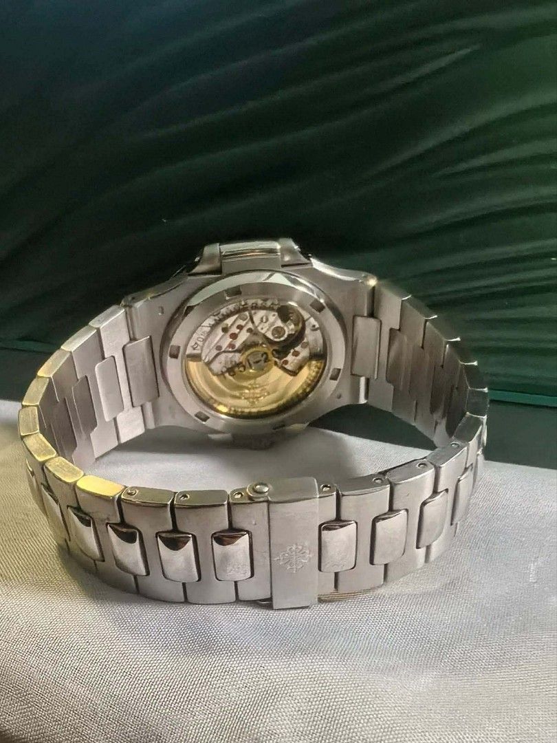 Patek Philippe Nautilus Tiffany Blue Dial Automatic Watch (Category: Luxury Watches) located in Bayugan. Submitted by daniel2019 (Listing ID 1442154121, Image 3). Description: - Patek Philippe Nautilus - Tiffany blue dial with horizontal lines - Date window at 3 o'clock - Stainless steel case and bracelet - Automatic movement (visible case back) - Highly sought-after collector's item.