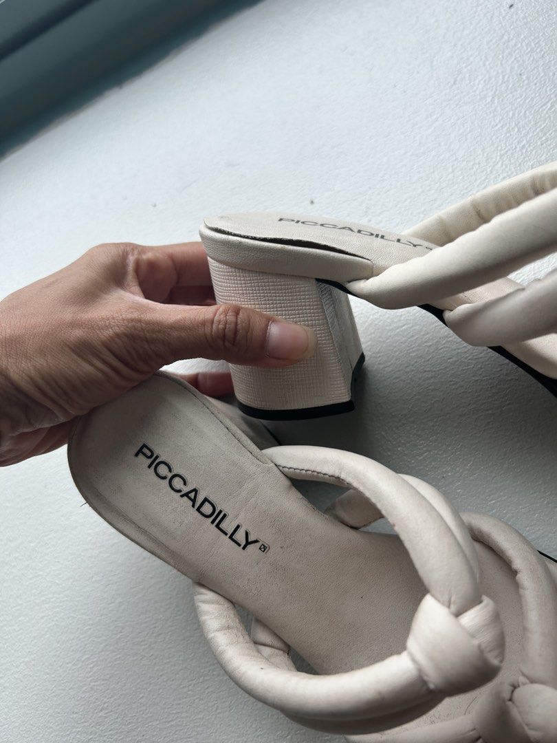 Piccadilly White Knotted Block Heel Sandals (Category: Heels) located in Makati City. Submitted by thriftbyhumble (Listing ID 1442040098, Image 2). Description: - White Piccadilly sandals - Size: 36 EUR / 5 USA - Knotted strap design - Comfortable block heel - Trendy square toe - Made in Brazil - Perfect for dressing up or down.