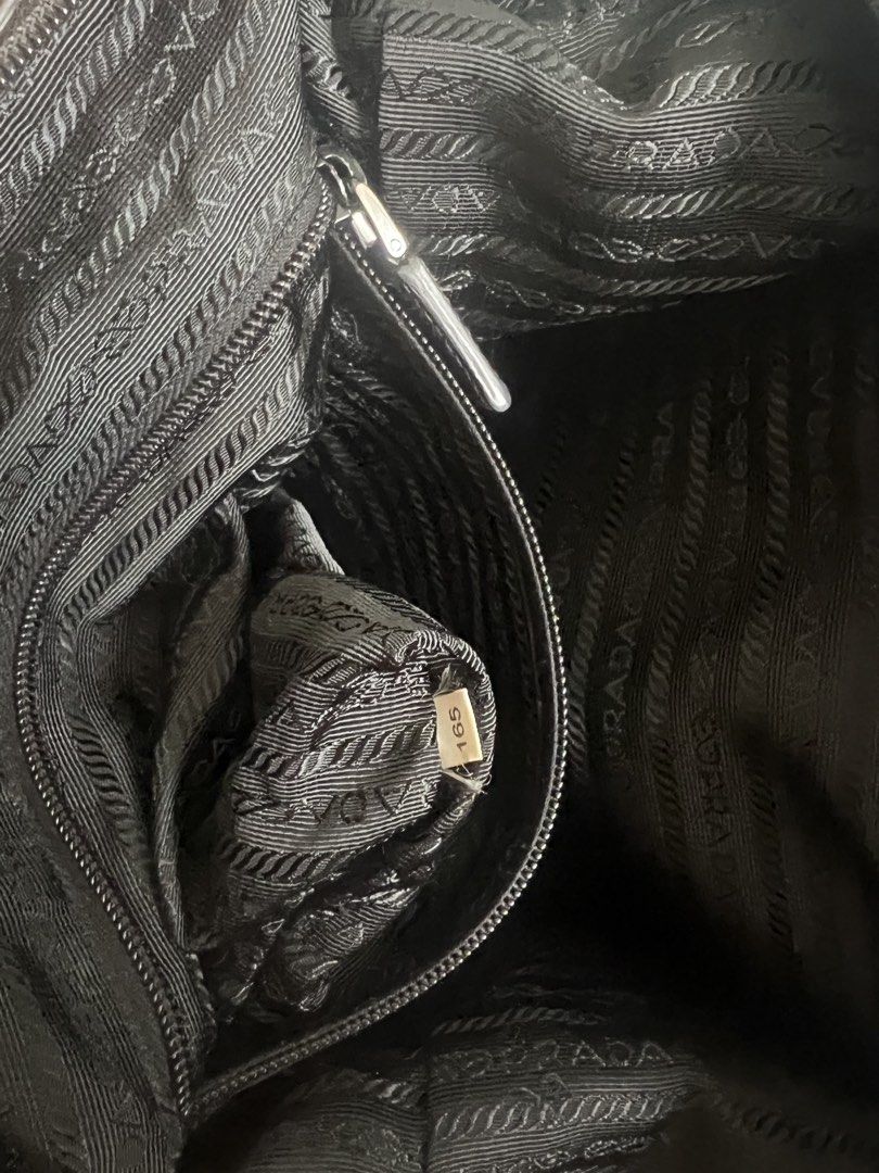 Prada Tessuto Nylon Leather Satchel Bag (Category: Shoulder Bags) located in Mandaluyong City. Submitted by zen_annarosa (Listing ID 1442083767, Image 2). Description: Authentic PRADA Tessuto Nylon and Saffiano Leather Top Handle Satchel Bag Selling this classic, versatile Prada duffel/satchel style bag. Perfect for daily use, travel. ✨ 100% AUTHENTIC – Fully verified and passed by POIZON Global Authentication Services (Certificate No. 1531915913