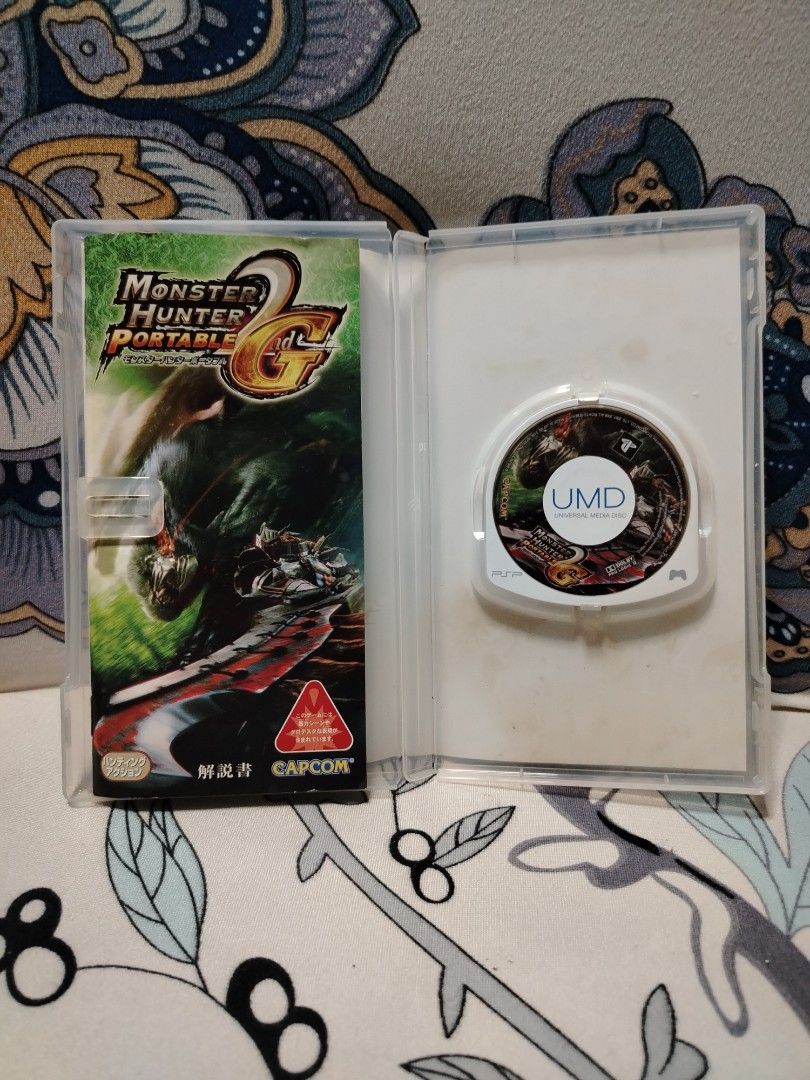 PSP Monster Hunter Portable 2nd G UMD Game Capcom (Category: PlayStation) located in Quezon City. Submitted by 09277011179 (Listing ID 1442070826, Image 2). Description: - Monster Hunter Portable 2nd G for PSP - 'PSP the Best' edition - Includes original UMD disc and case - Japanese version - Classic action RPG experience.