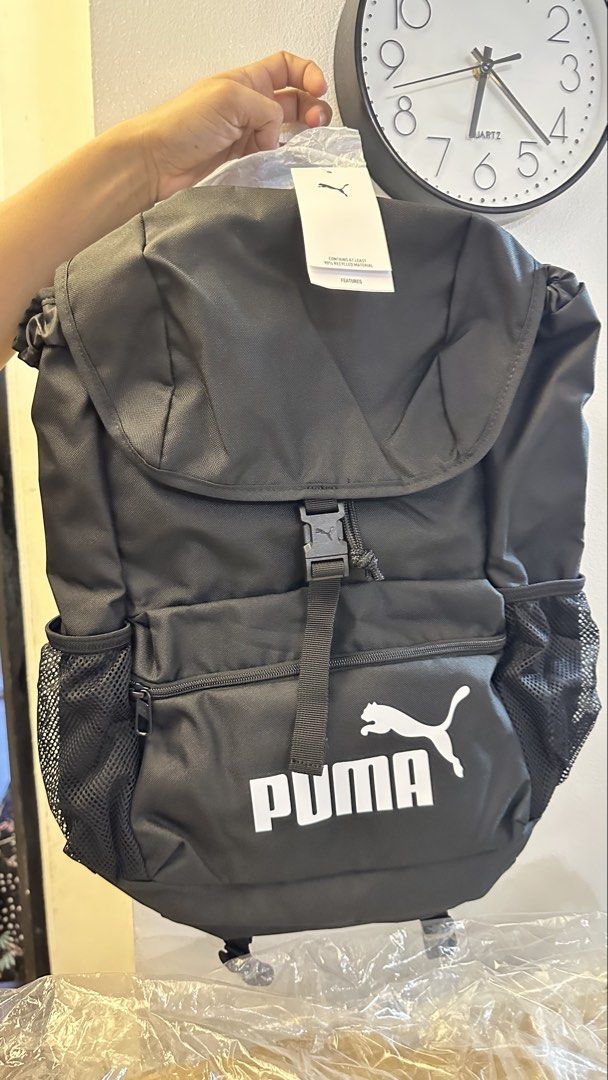 Puma Black Backpack (Category: Backpacks) located in Taguig. Submitted by bpyte0408 (Listing ID 1442085311, Image 1). Description: BRAND NEW - Classic black Puma backpack - Main compartment with secure drawstring and buckle closure - Two convenient side mesh pockets for water bottles or essentials - Comfortable padded shoulder straps for easy carrying - Ideal for school, gym, or everyday adventures.