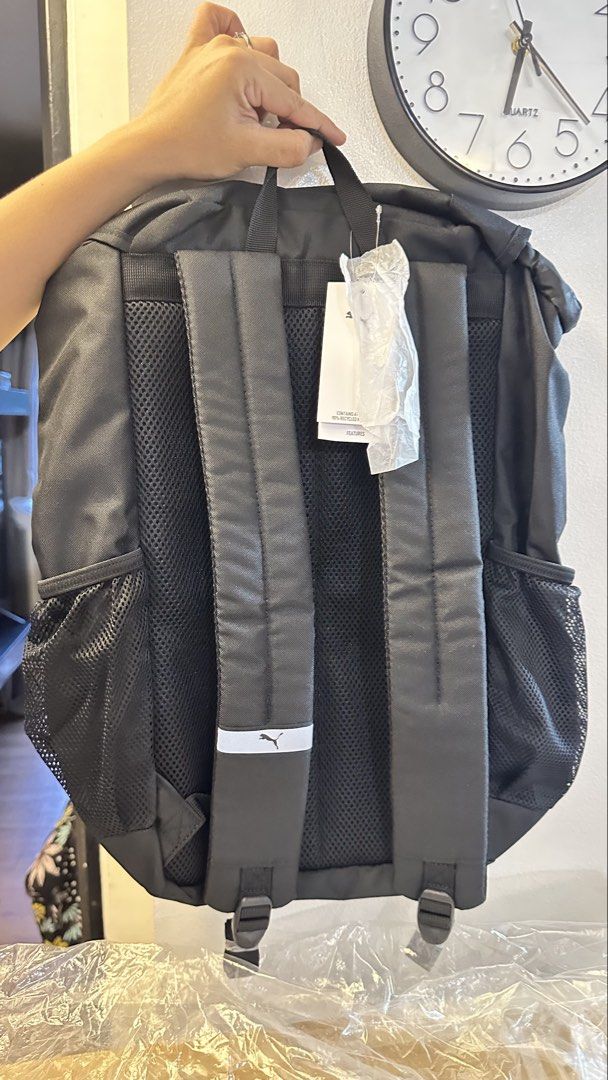 Puma Black Backpack (Category: Backpacks) located in Taguig. Submitted by bpyte0408 (Listing ID 1442085311, Image 2). Description: BRAND NEW - Classic black Puma backpack - Main compartment with secure drawstring and buckle closure - Two convenient side mesh pockets for water bottles or essentials - Comfortable padded shoulder straps for easy carrying - Ideal for school, gym, or everyday adventures.