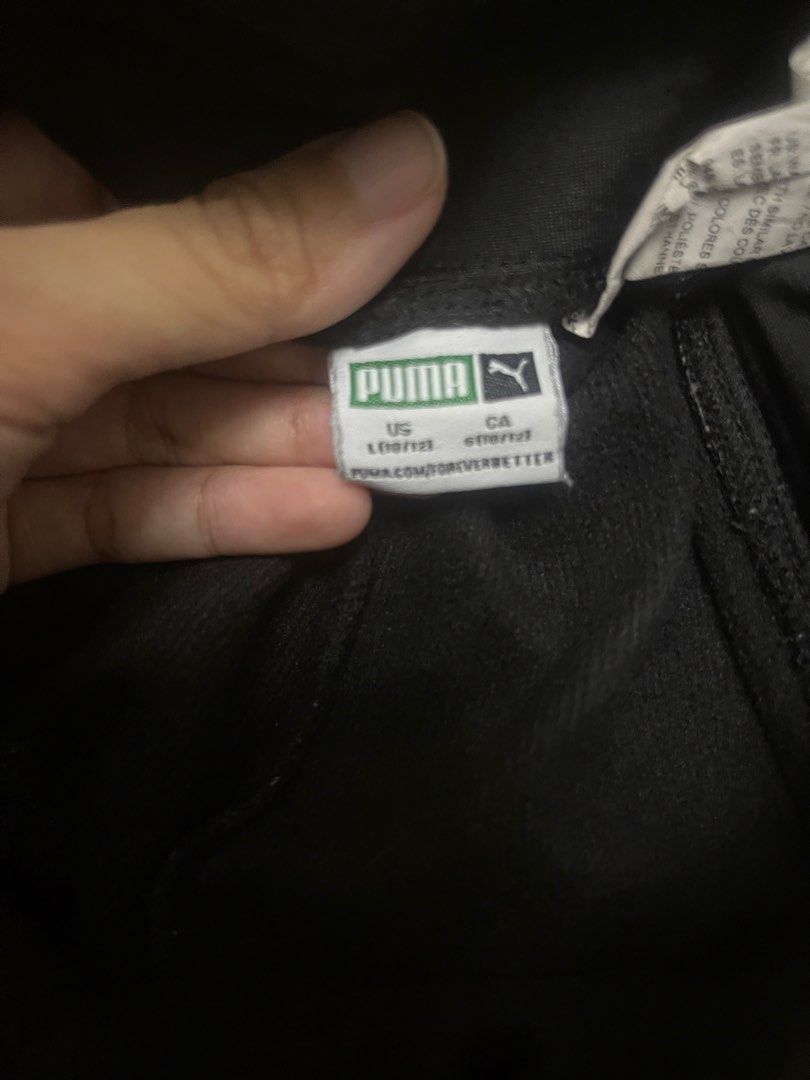 Puma Black Leggings (Category: Activewear) located in Lucena. Submitted by halfrackph (Listing ID 1442090198, Image 3). Description: - Black Puma joggers - Size: US L kids(12/14) - Large white Puma logo on left leg - Comfortable elastic waistband - Material: 100% polyester - Ideal for sports and casual wear.
