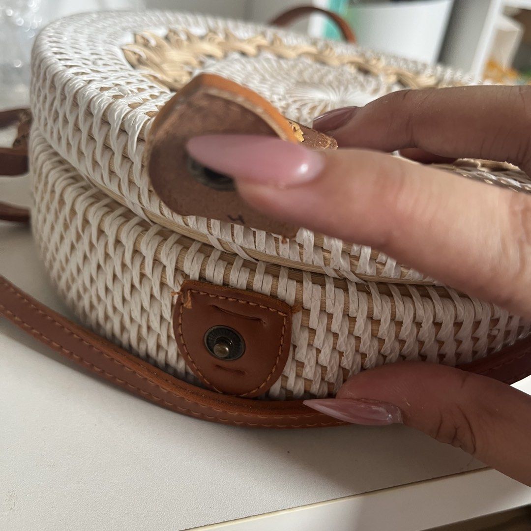Rattan Round Bag w/ Leather Strap (Category: Cross-body Bags) located in Legazpi City. Submitted by hushedcry (Listing ID 1442028506, Image 3). Description: - White woven exterior - Tan leather strap and details - Colorful patterned fabric lining - Secure snap button closure - for beach days and casual outings - Unique and stylish design - No flaws BNEW rfs: have too many bags :( 💌 mop: gcash / maya accepted 📬 shipping via j&t express (sf c/o b