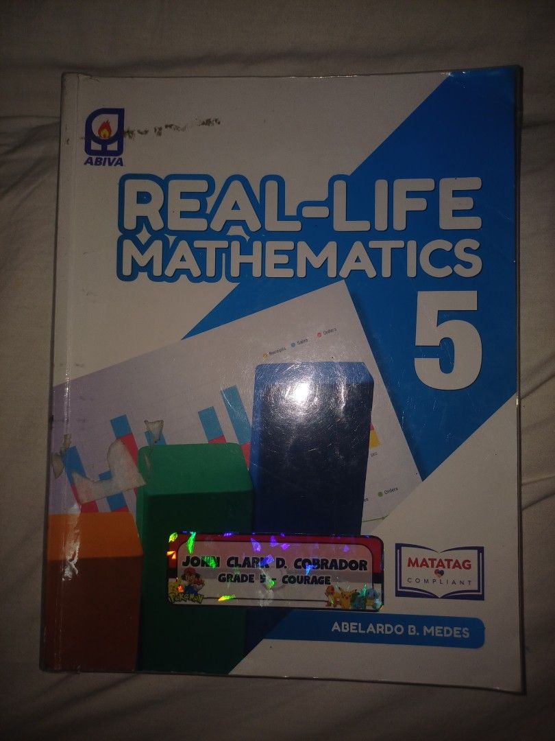 Real-Life Mathematics 5 Textbook by Abiva (Category: Textbooks) located in Manila. Submitted by choco.cobrador_30 (Listing ID 1442016433, Image 1). Description: - Real-Life Mathematics 5 textbook - Published by Abiva - For Grade 5 students - Workbook style, great for math practice - Shows some writing, as seen in photos.