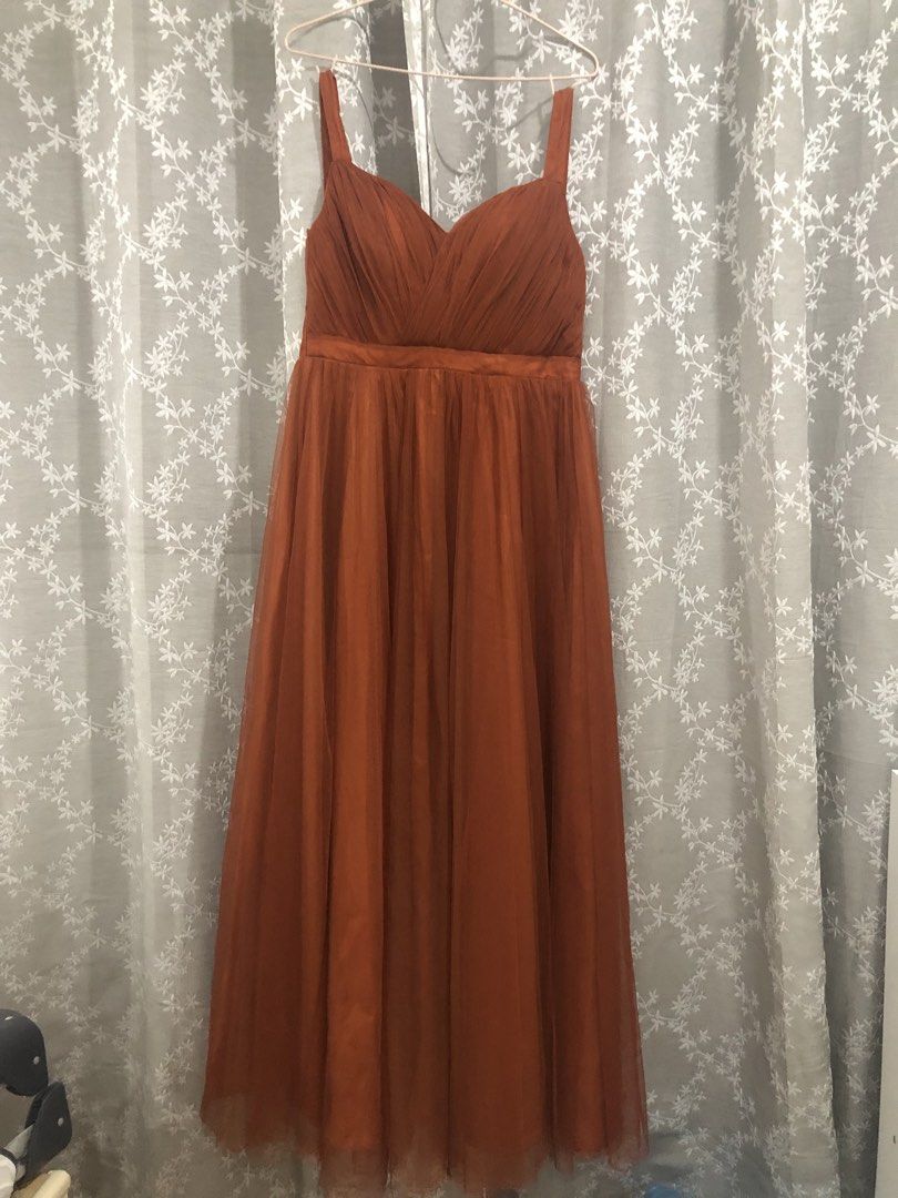 Rust Orange Bridesmaid Tulle Dress (Category: Evening dresses & gowns) located in Manila. Submitted by icamqz (Listing ID 1441987526, Image 1). Description: - Stunning rust orange tulle dress - Sweetheart neckline with flattering ruched bodice - Adjustable corset lace-up back - Elegant floor-length skirt - Worn only once for a wedding -Can fit M-L -Padded top -Robe rust orange for FREE.