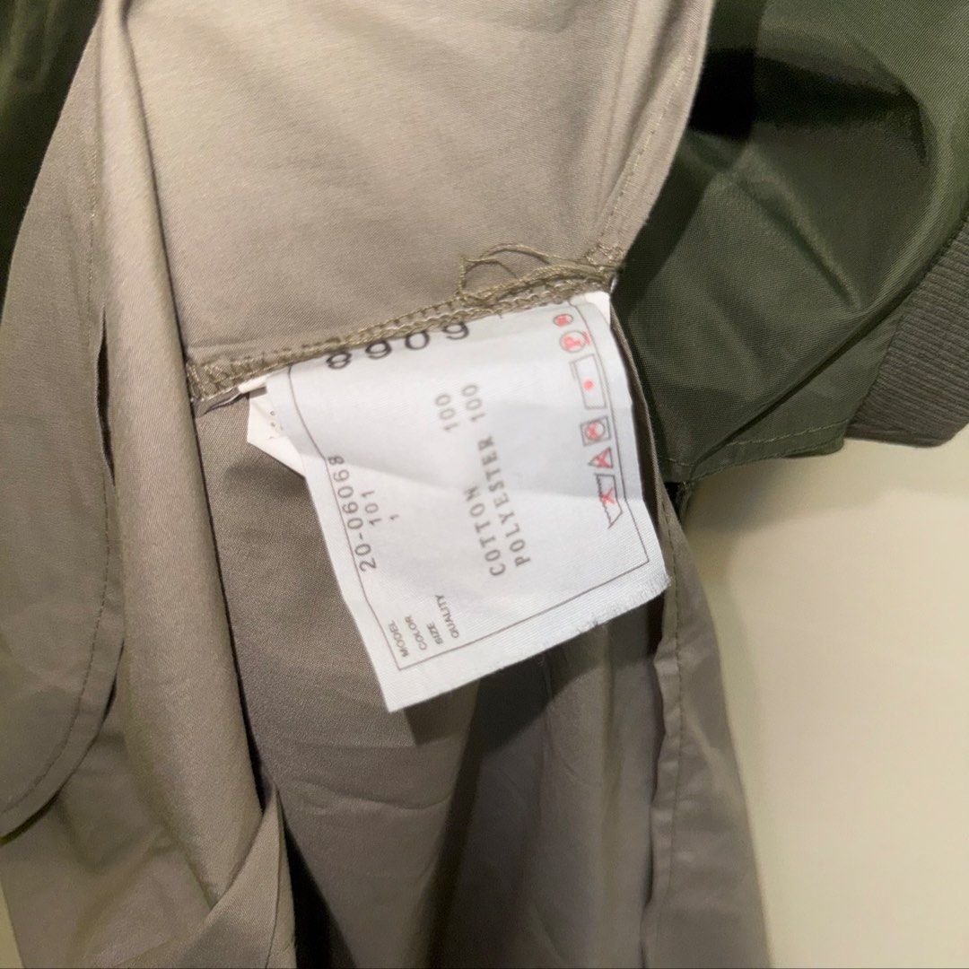 Sacai MA-1 Down Flare Vest (Category: Others Tops) located in Calasiao. Submitted by jafaith_man (Listing ID 1442115818, Image 3). Description: This Sacai MA-1 down flare vest features a distinctive hybrid design combining a technical nylon bomber upper with a draped, handkerchief hem. Size 1 Small frame Length 35 in. Width 21 in. .