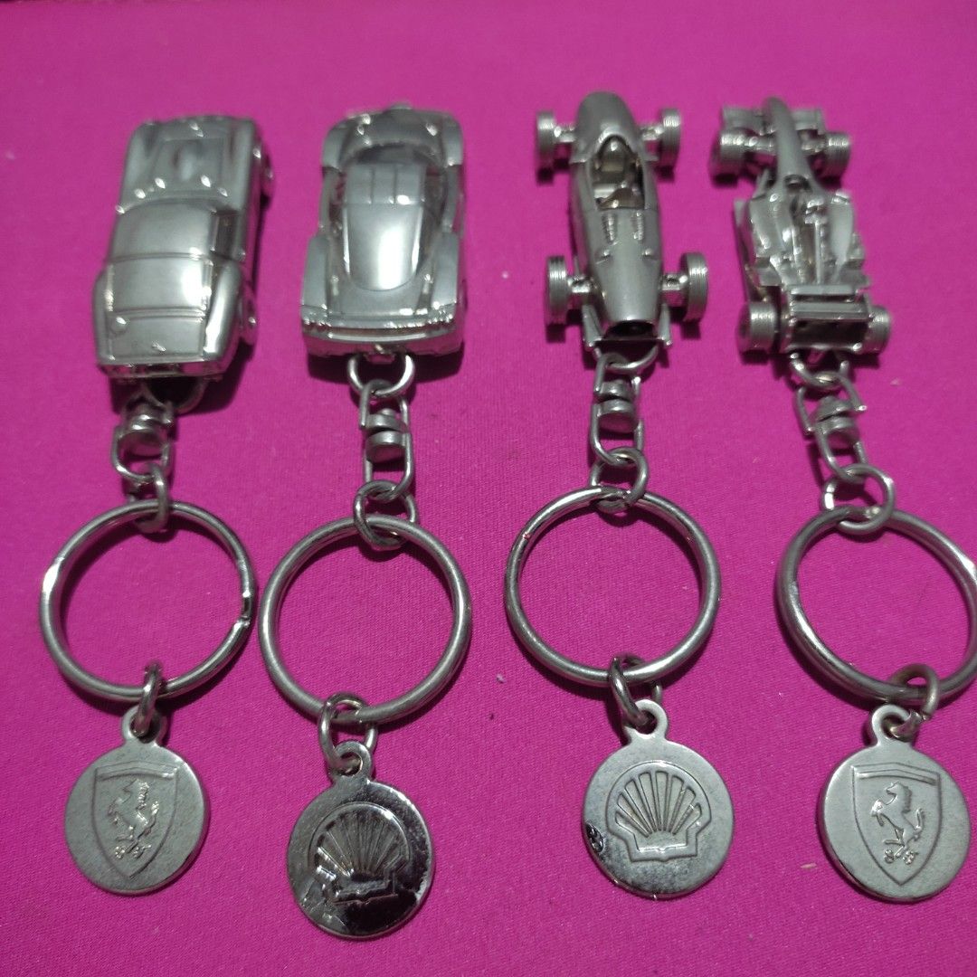 Set of 4 FERRARI Shell V-Power Keychain (Category: Vehicle & Diecast Models) located in Las Pinas. Submitted by lawki_stuff (Listing ID 1442014056, Image 3). Description: - Set of 4 unique metal original Ferrari Shell V-Power keychains - Includes 2 classic sports car designs. - Includes 2 Formula 1 race car designs. - Each keychain features a durable metal car charm. - Comes with a circular metal tag on each. - Ideal for car enthusiasts and colle