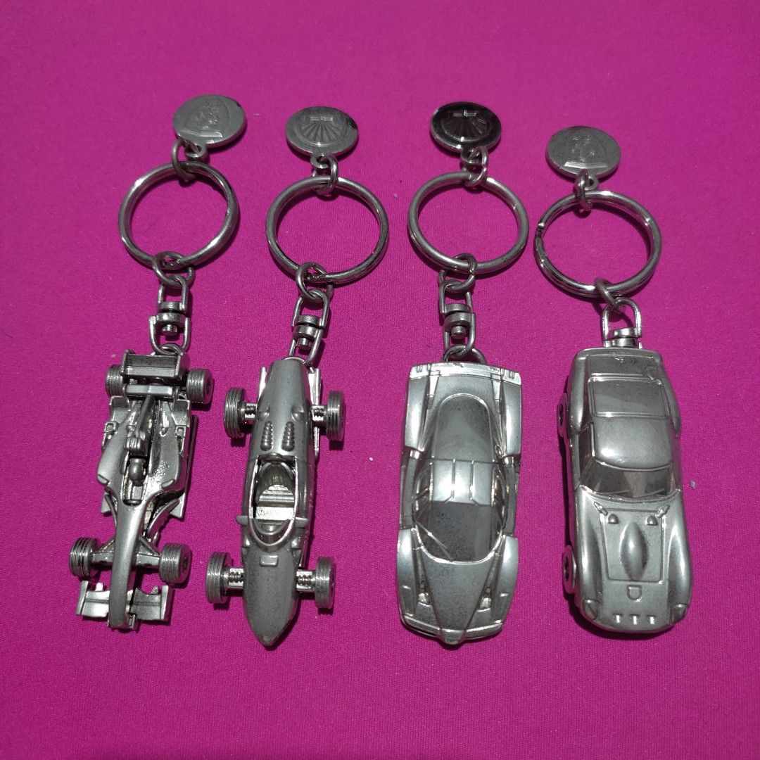Set of 4 FERRARI Shell V-Power Keychain (Category: Vehicle & Diecast Models) located in Las Pinas. Submitted by lawki_stuff (Listing ID 1442014056, Image 1). Description: - Set of 4 unique metal original Ferrari Shell V-Power keychains - Includes 2 classic sports car designs. - Includes 2 Formula 1 race car designs. - Each keychain features a durable metal car charm. - Comes with a circular metal tag on each. - Ideal for car enthusiasts and colle