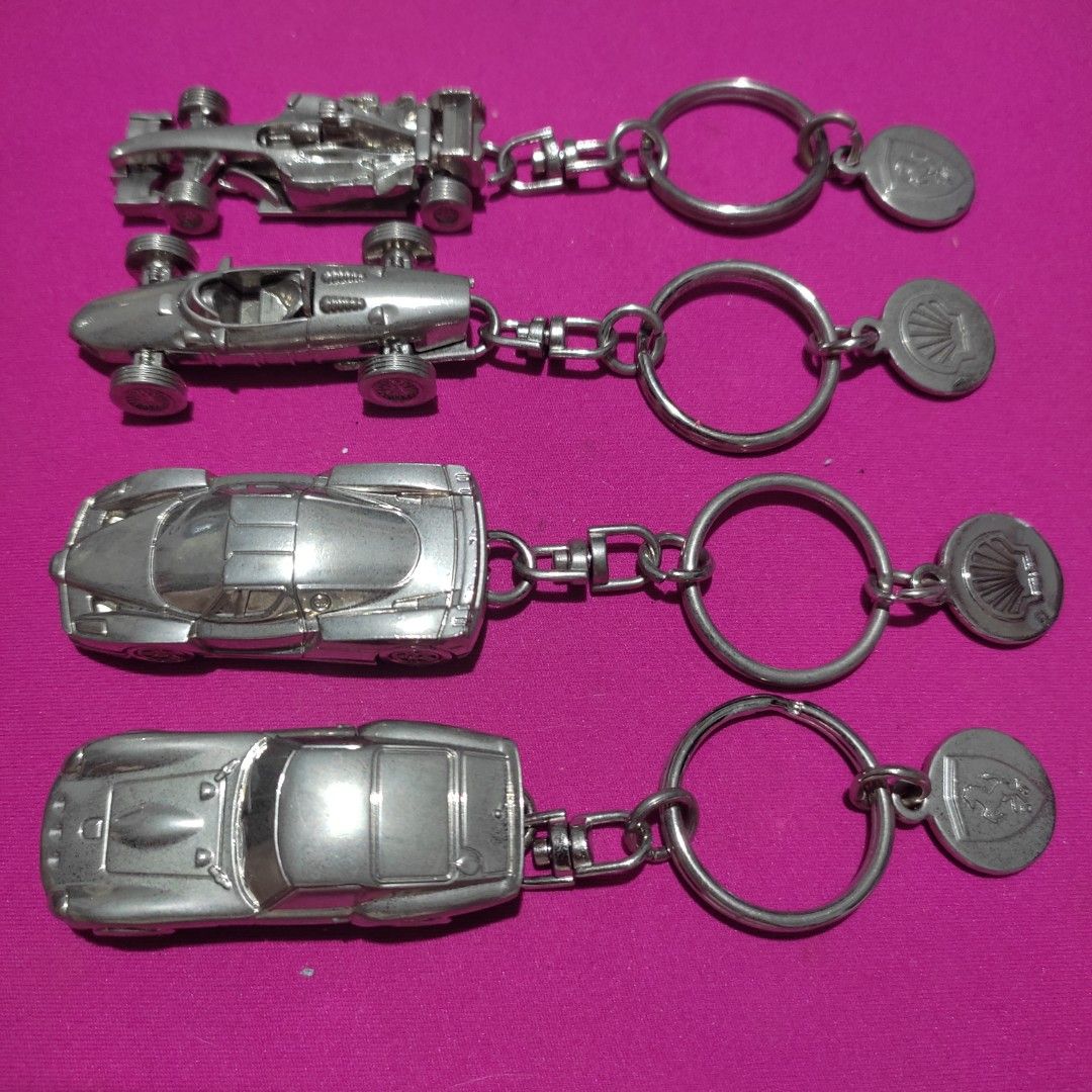 Set of 4 FERRARI Shell V-Power Keychain (Category: Vehicle & Diecast Models) located in Las Pinas. Submitted by lawki_stuff (Listing ID 1442014056, Image 2). Description: - Set of 4 unique metal original Ferrari Shell V-Power keychains - Includes 2 classic sports car designs. - Includes 2 Formula 1 race car designs. - Each keychain features a durable metal car charm. - Comes with a circular metal tag on each. - Ideal for car enthusiasts and colle