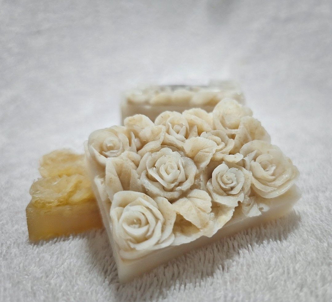 Shea Butter Breastmilk Soap (Category: Bath) located in Imus. Submitted by jamillabrillantes (Listing ID 1442020727, Image 1). Description: - Beautifully carved soap bars with intricate rose designs. - Creamy white main bar. - Smaller yellow bar with floral pattern. - Lovely decorative piece or unique gift. - Delicate, natural look. - Perfect for bathroom display..