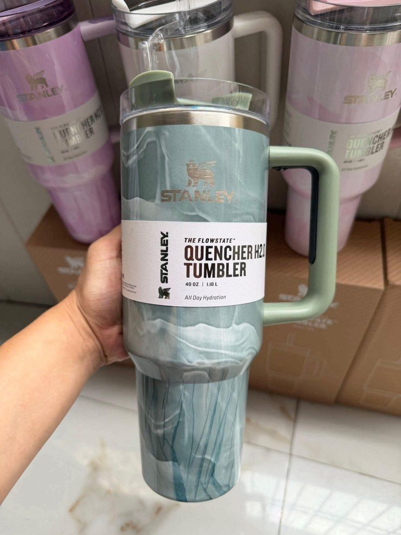 Stanley Quencher H2.0 Flowstate Tumbler 40oz Marble Swirl (Category: Water Bottles & Tumblers) located in Manila. Submitted by declutbykai (Listing ID 1441982337, Image 3). Description: - Stanley Quencher H2.0 Flowstate Tumbler with Box - 40 oz capacity - Keeps drinks cold all day - Includes reusable straw and handle - Available in marble swirl patterns: pink, white, and green STOCK AVAILABLE .