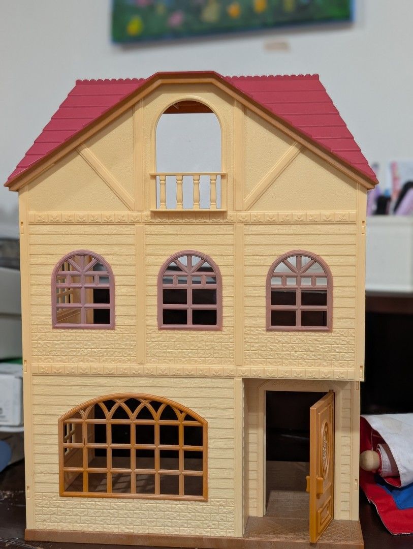 Sylvanian family with Red Roof (Category: Kids Toys) located in Makati City. Submitted by shruti11s (Listing ID 1441999934, Image 1). Description: - Three-story Sylvanian family house with a charming red roof. - Features multiple windows and an inviting open front door. - Interior is visible, showcasing two floors of play space. - Ideal for sparking imaginative play and decorating with dolls and furniture. - Ample room for creativity and storytel