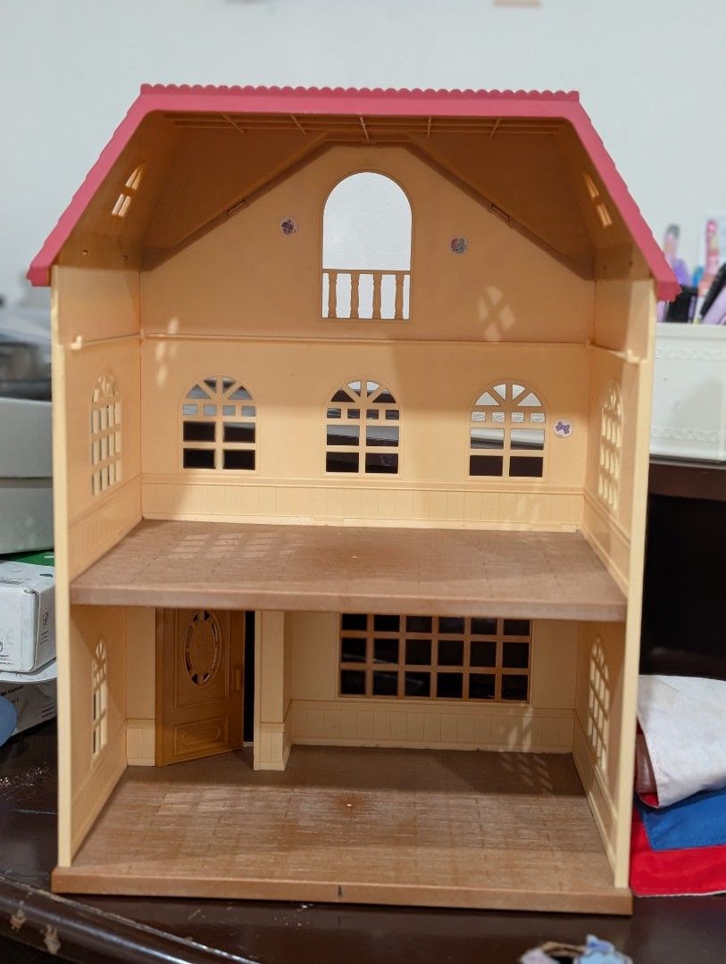 Sylvanian family with Red Roof (Category: Kids Toys) located in Makati City. Submitted by shruti11s (Listing ID 1441999934, Image 2). Description: - Three-story Sylvanian family house with a charming red roof. - Features multiple windows and an inviting open front door. - Interior is visible, showcasing two floors of play space. - Ideal for sparking imaginative play and decorating with dolls and furniture. - Ample room for creativity and storytel