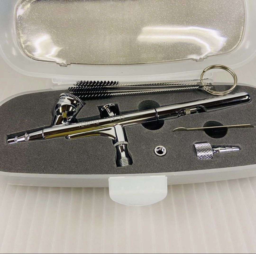 Temptu SP-35 Airbrush Makeup System with Compressor and Accessories (Category: Makeup) located in Naga. Submitted by perperrrro (Listing ID 1442135499, Image 3). Description: TEMPTU PRO SP-35 Airbrush Kit Used only once. It is in like-new condition and very clean (bought last february) This is a professional airbrush makeup set that includes a dual-action airbrush with a 0.35mm needle/nozzle, a dedicated compressor, and Temptu DURA liquid bottles