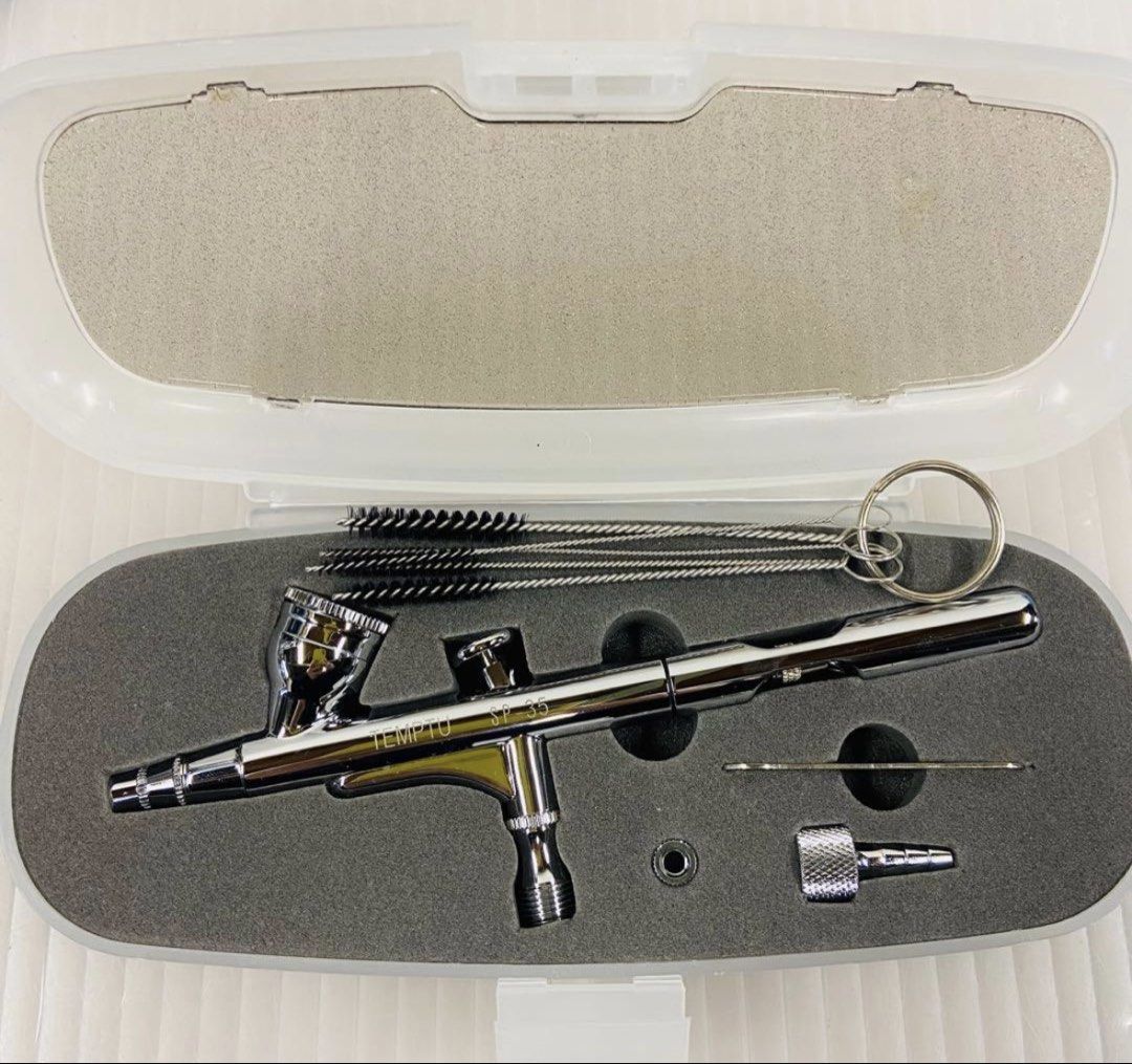 Temptu SP-35 Airbrush Makeup System with Compressor and Accessories (Category: Makeup) located in Naga. Submitted by perperrrro (Listing ID 1442135499, Image 2). Description: TEMPTU PRO SP-35 Airbrush Kit Used only once. It is in like-new condition and very clean (bought last february) This is a professional airbrush makeup set that includes a dual-action airbrush with a 0.35mm needle/nozzle, a dedicated compressor, and Temptu DURA liquid bottles