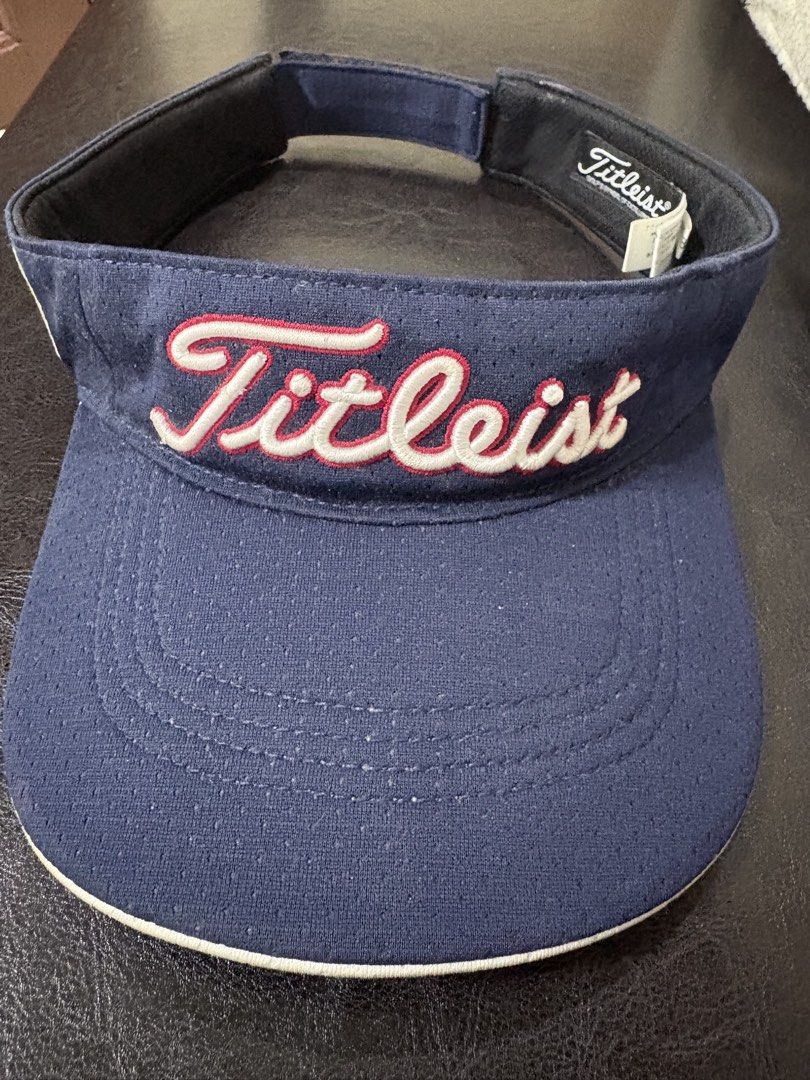 Titleist Golf Visor Navy Blue (Category: Caps & Hats) located in Quezon City. Submitted by viee04 (Listing ID 1442017322, Image 1). Description: - Navy blue Titleist visor - Embroidered logo on the front - Adjustable strap for a comfortable fit - Ideal for golf and outdoor activities - Provides sun protection for your eyes - Classic and simple design.