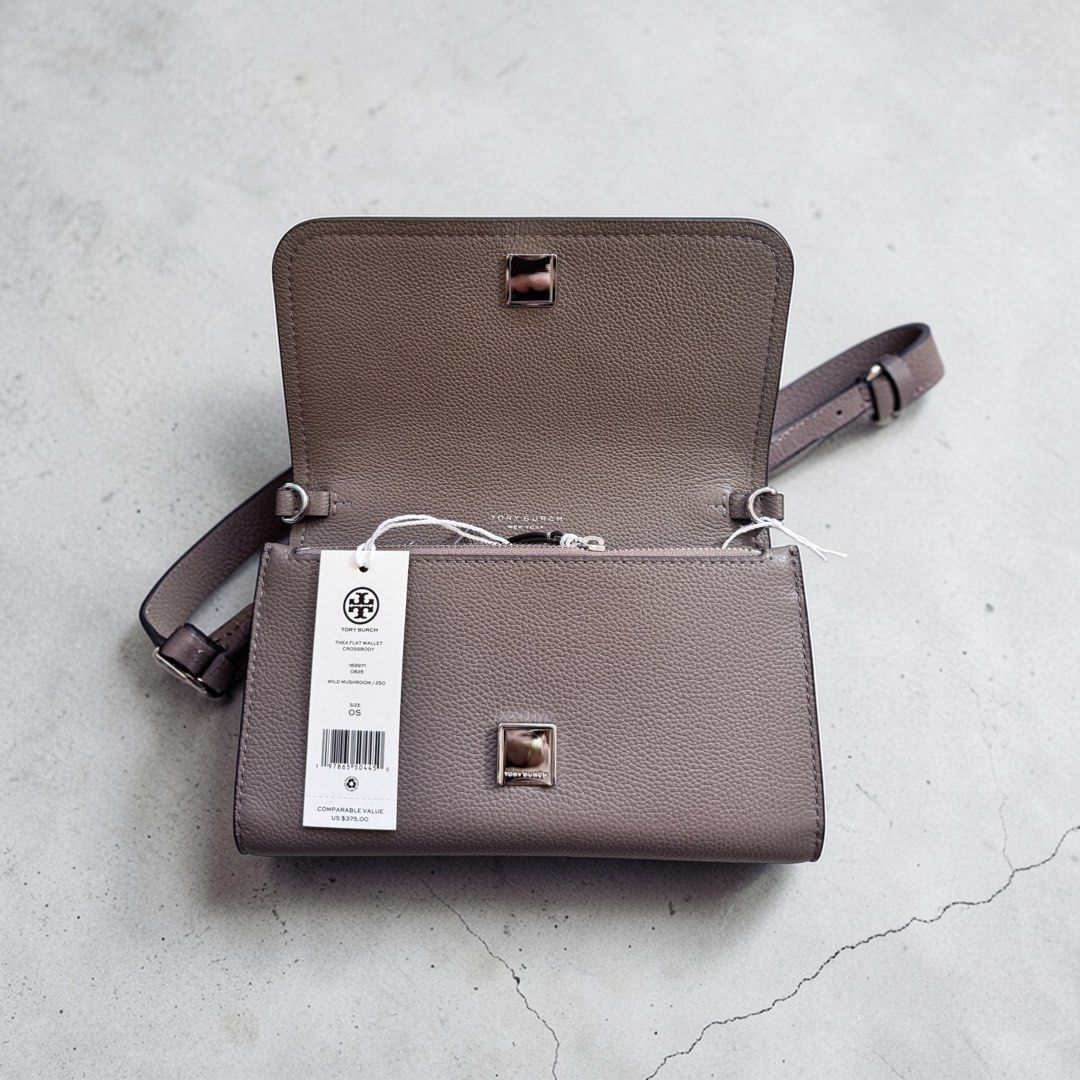 Tory Burch Wallet (Category: Luxury Bags & Wallets) located in Davao. Submitted by ishdy (Listing ID 1442081497, Image 3). Description: - Genuine Grey Tory Burch Wallet - Made of high-quality Leather - Secure snap closure - Convenient interior zip compartment - Includes a detachable strap for versatility - Brand new with original tags still attached.