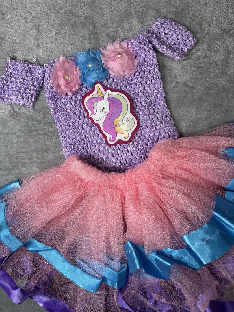 Unicorn Dress for baby (Category: Babies & Kids Fashion) located in Manila. Submitted by oddstar_862365 (Listing ID 1442012649, Image 1). Description: - Adorable handmade unicorn tutu dress - Lavender crochet top with flower and pearl embellishments - Fluffy pink and blue tutu skirt with ribbon accents - Perfect for parties and dress-up occasions - Your child will love this magical outfit!.