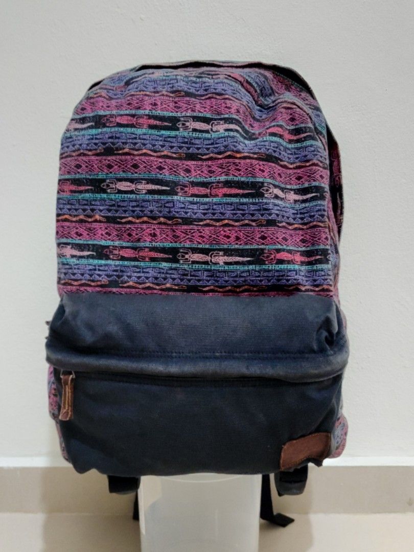 Vans Backpack (Category: Backpacks) located in Sepang. Submitted by alee73 (Listing ID 1442065708, Image 1). Description: - Vans Backpack - Bohemian pattern on the front. - Durable denim-like material on sides and back. - Comfortable padded shoulder straps. - Spacious main compartment with zip closure. - Convenient front pocket for easy access. - Sturdy and reliable for everyday use or travel. - Condition 8/10.