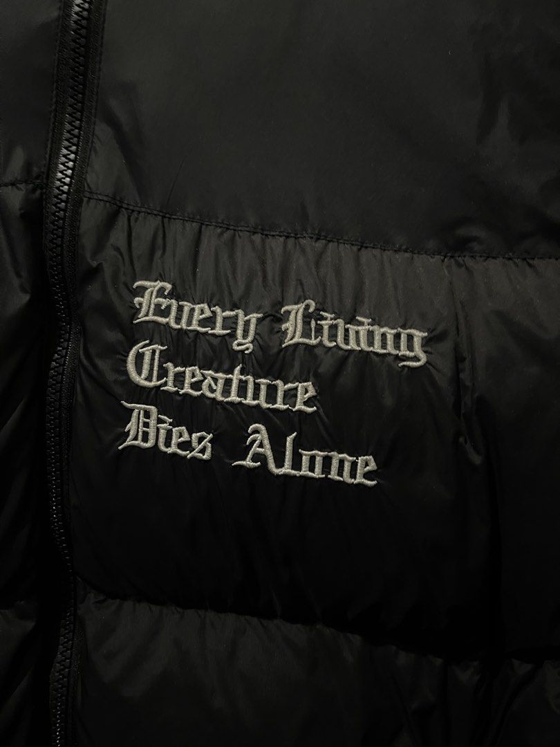 VLONE Puffer Jacket Black (Category: Coats, Jackets and Outerwear) located in Angeles City. Submitted by hellywhut (Listing ID 1442126313, Image 3). Description: - Rare Only! - Black VLONE puffer jacket - Iconic VLONE 'V' embroided logo - Embroidered text 'Every Living Creature Dies Alone' on the front - VLONE logo on the zipper pull .
