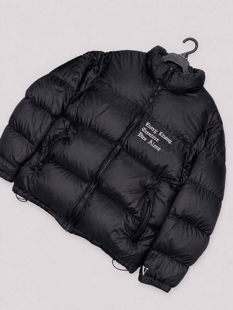 VLONE Puffer Jacket Black (Category: Coats, Jackets and Outerwear) located in Angeles City. Submitted by hellywhut (Listing ID 1442126313, Image 2). Description: - Rare Only! - Black VLONE puffer jacket - Iconic VLONE 'V' embroided logo - Embroidered text 'Every Living Creature Dies Alone' on the front - VLONE logo on the zipper pull .