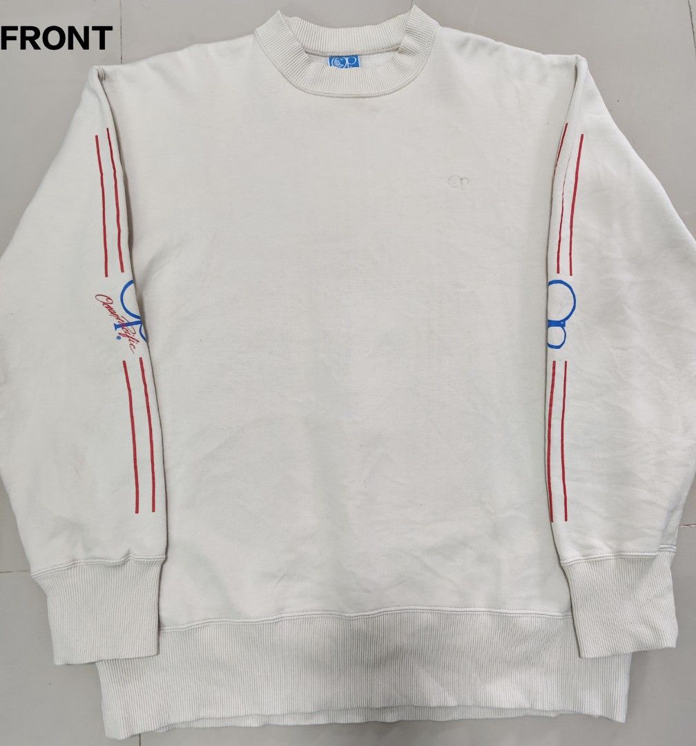 VTG Ocean Pacific OP White Sweatshirt (Category: Coats, Jackets and Outerwear) located in Cavite. Submitted by whew12 (Listing ID 1442009724, Image 1). Description: This item is a vintage Ocean Pacific (OP) crewneck sweatshirt featuring a clean off-white body with contrasting red and blue racing stripes running down the length of both sleeves. - White Ocean Pacific sweatshirt - Features OP logo on back and sleeve - Red and blue stripe details on 