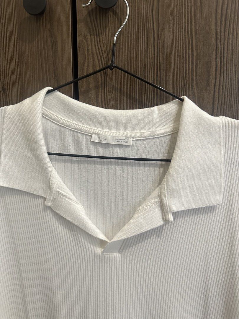 Zara Ribbed Polo Shirt White (Category: Shirts) located in Cavite. Submitted by kaydacanay (Listing ID 1442079953, Image 2). Description: - Zara white ribbed polo shirt - Short sleeves - Classic collar - Relaxed fit - Ideal for casual wear - Versatile styling - Comfortable fabric.