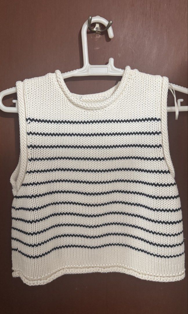 Zara Striped Knit Vest Top (Category: Sleeveless) located in Paranaque City. Submitted by migvee (Listing ID 1442050806, Image 3). Description: - Zara cream and navy striped knit vest - Sleeveless, cropped fit - Versatile for layering over t-shirts or wearing solo - Ideal for a casual, chic aesthetic - Easily pairs with jeans or shorts.